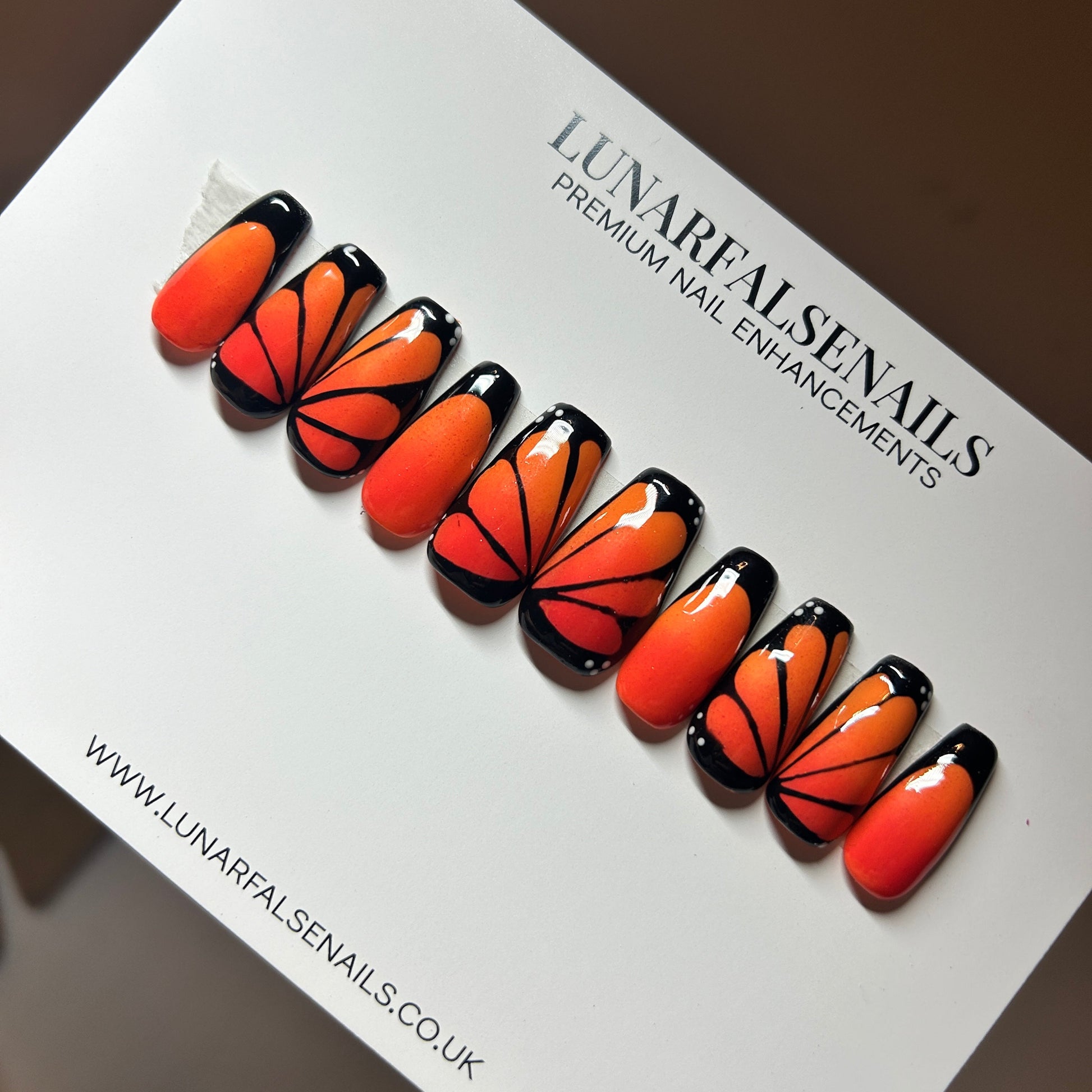 Butterfly-themed false nails on a white card with 'Lunar False Nails' branding.